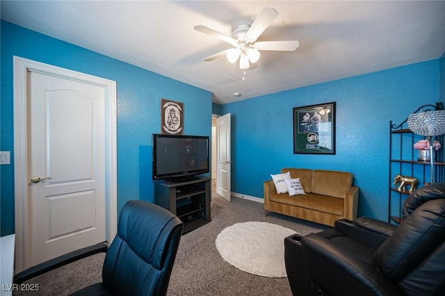 carpeted living room featuring ceiling fan