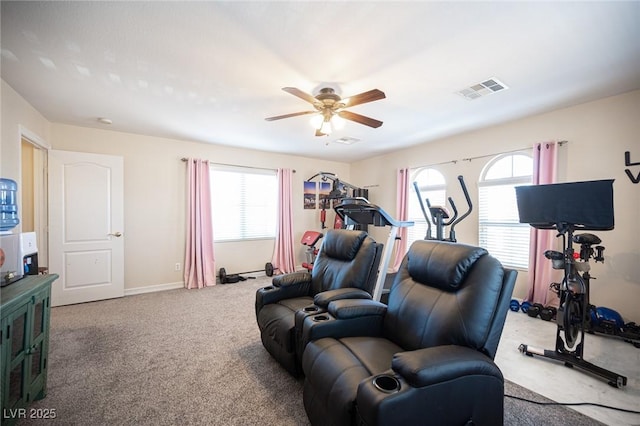 exercise room featuring ceiling fan and carpet floors