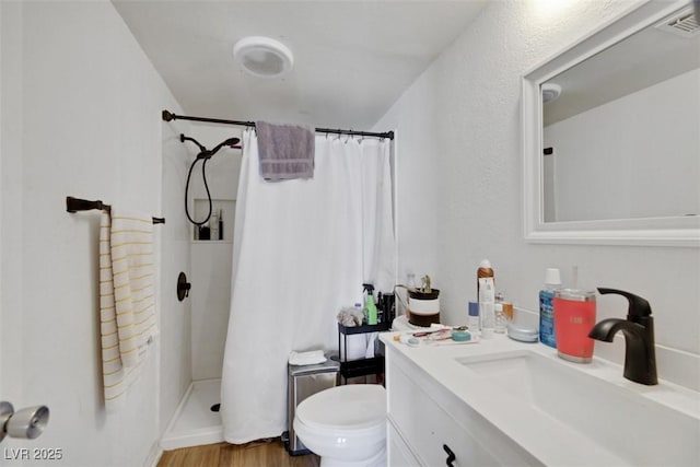 3473 Monte Carlo Dr, Las Vegas, NV 89121 - bathroom with vanity, a shower with shower curtain, and wood finished floors