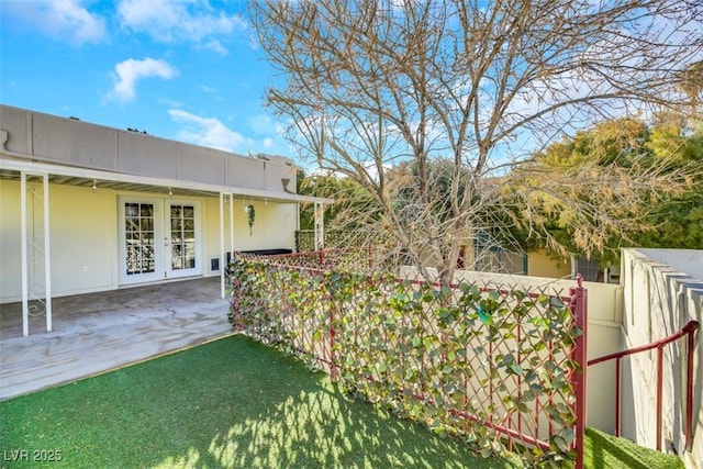 3473 Monte Carlo Dr, Las Vegas, NV 89121 - view of yard with french doors and a patio