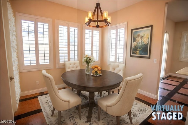 dining space with an inviting chandelier