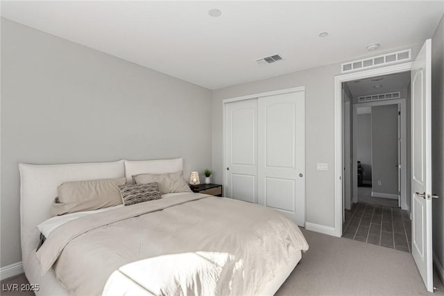 carpeted bedroom featuring a closet