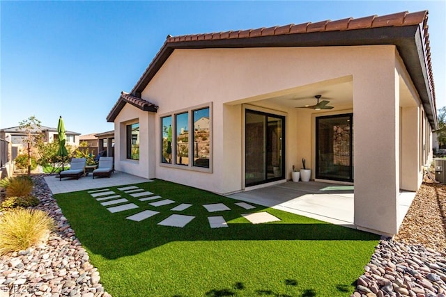 rear view of house with a patio and ceiling fan