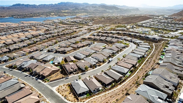 aerial view featuring a water and mountain view