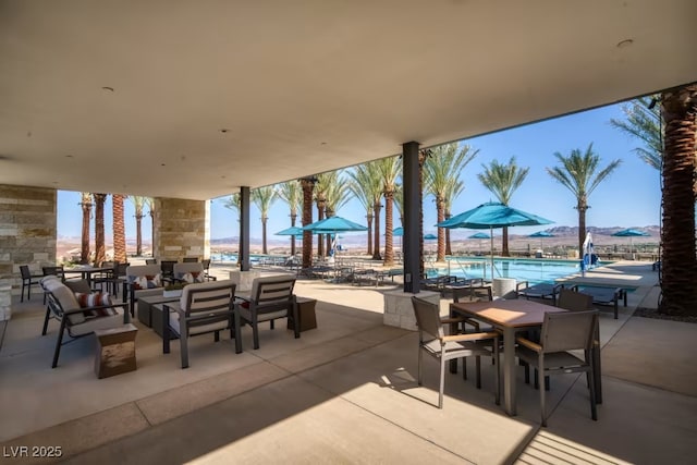 view of patio with a community pool