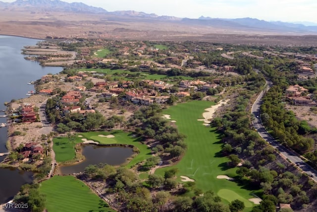 birds eye view of property with a water and mountain view