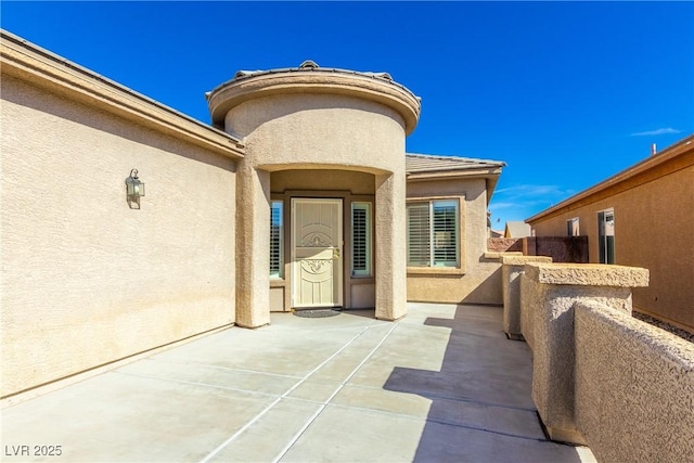 doorway to property featuring a patio area