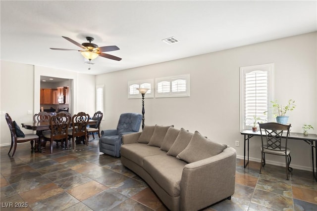 living room featuring ceiling fan