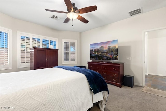 bedroom featuring light carpet and ceiling fan