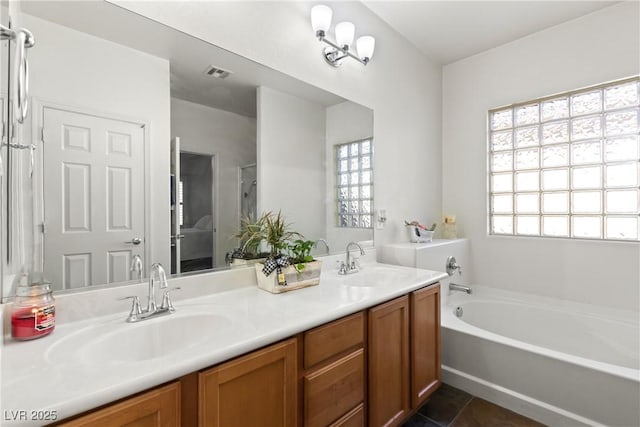 bathroom with vanity and a bathtub