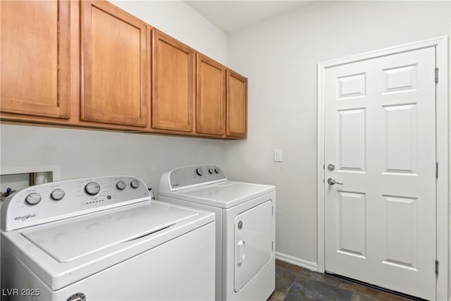 laundry area featuring cabinets and separate washer and dryer