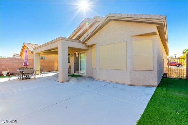 rear view of house featuring a patio