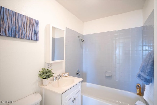 full bathroom with vanity, toilet, and tiled shower / bath combo