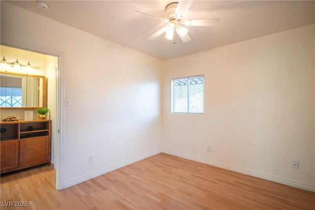 unfurnished room with light hardwood / wood-style floors and ceiling fan