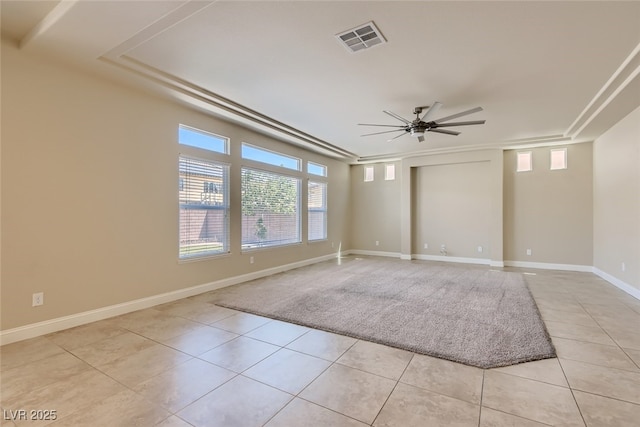 empty room featuring ceiling fan and light tile patterned floors