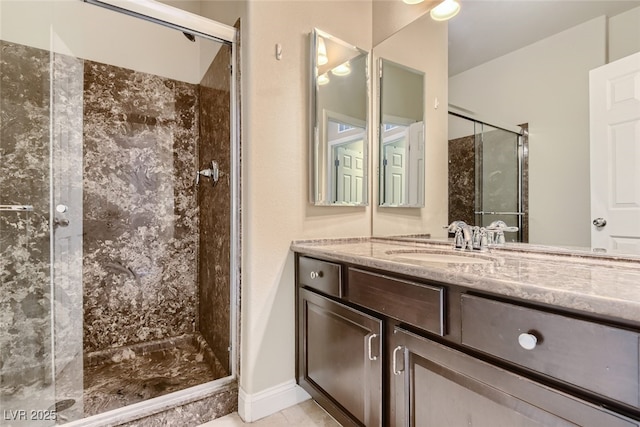 bathroom featuring vanity and an enclosed shower