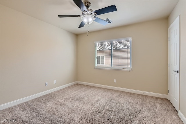 unfurnished room featuring ceiling fan and carpet