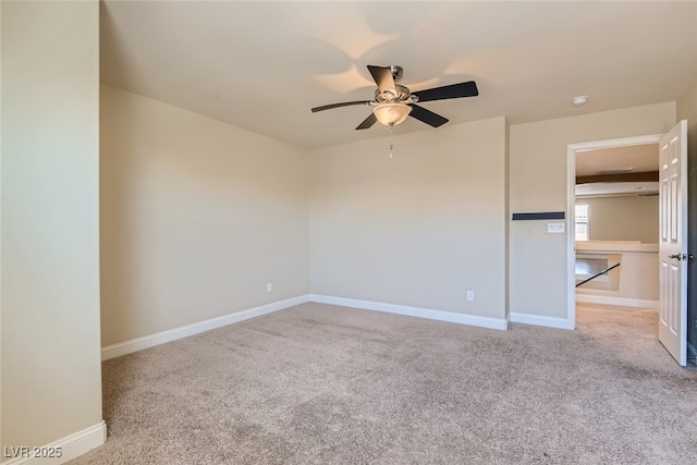 empty room with light carpet and ceiling fan