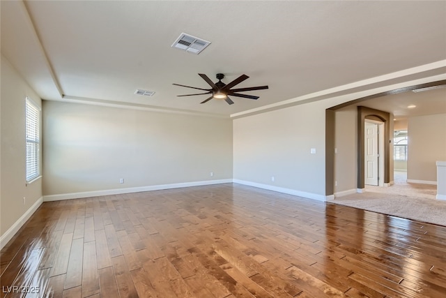 spare room featuring hardwood / wood-style flooring and ceiling fan