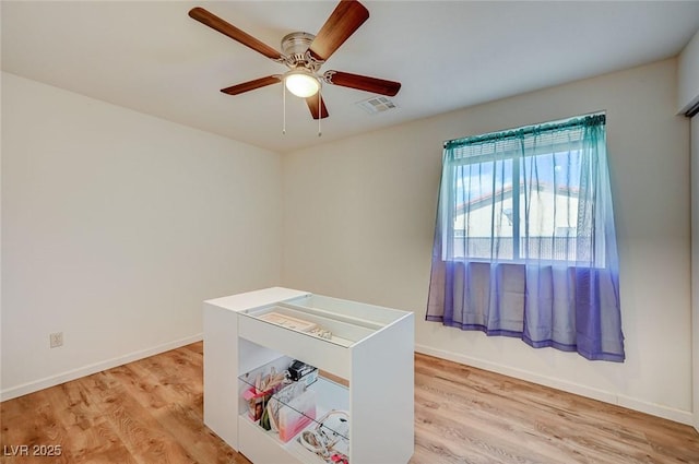 office featuring ceiling fan and light wood-type flooring