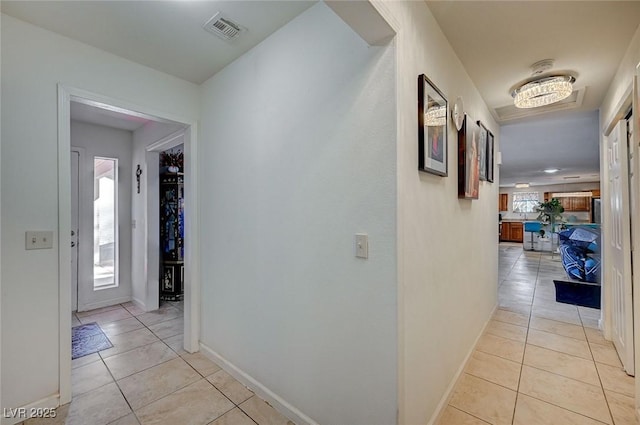 hallway with light tile patterned floors