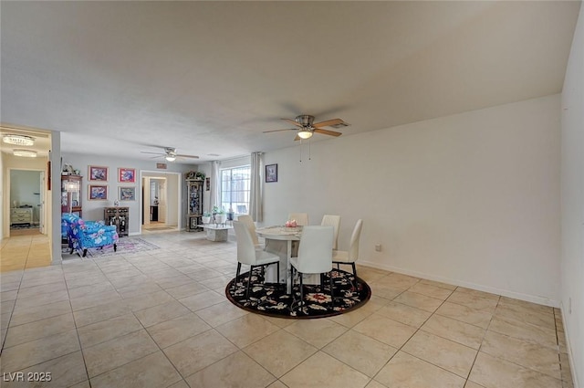 dining room featuring ceiling fan and light tile patterned floors