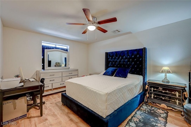 bedroom featuring light hardwood / wood-style flooring and ceiling fan