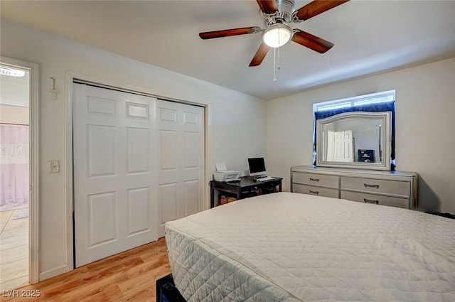 bedroom featuring a closet, ceiling fan, and light hardwood / wood-style flooring