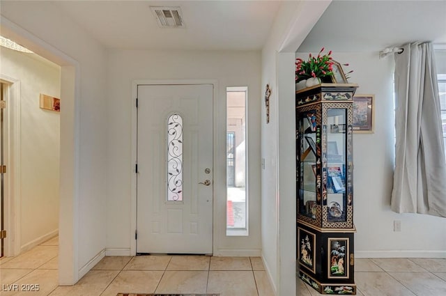 entrance foyer with light tile patterned flooring