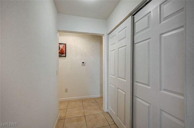 corridor featuring light tile patterned floors