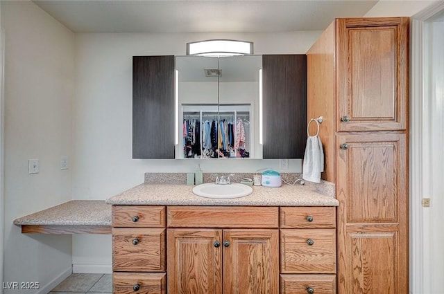 bathroom featuring vanity and tile patterned flooring