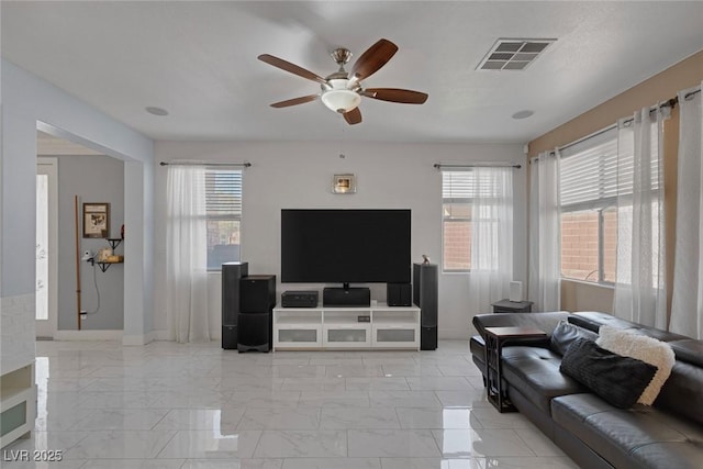 living room with ceiling fan