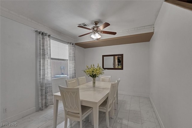 dining room featuring ceiling fan