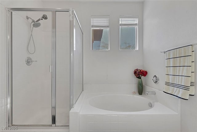 bathroom featuring independent shower and bath and radiator