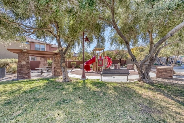 view of yard with a playground and a patio