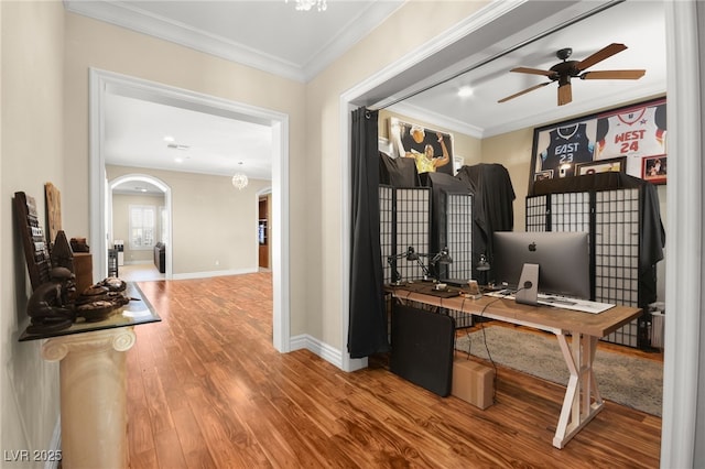 interior space featuring hardwood / wood-style floors, crown molding, and ceiling fan