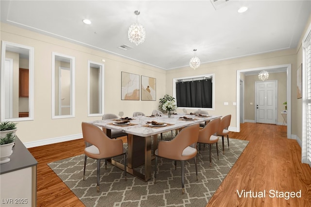 dining room featuring dark hardwood / wood-style floors and a chandelier