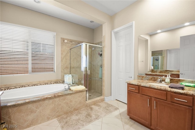 bathroom featuring vanity and shower with separate bathtub