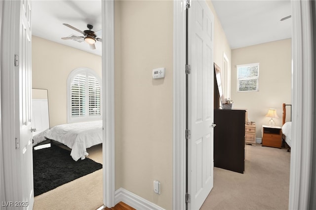 corridor with light colored carpet