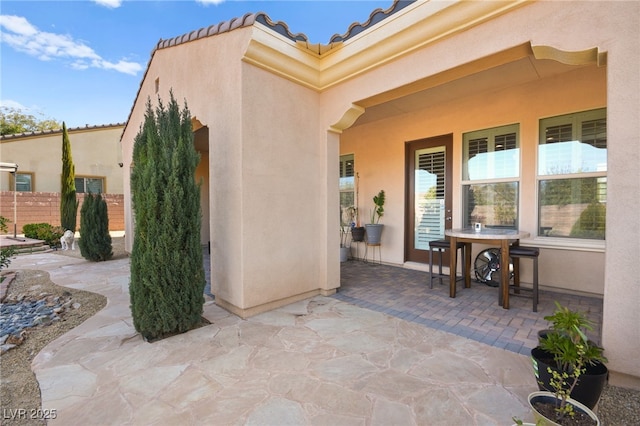 doorway to property featuring a patio area