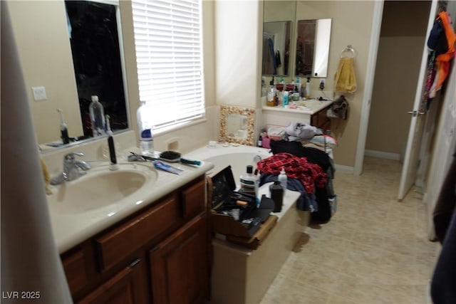 bathroom featuring vanity and a tub to relax in