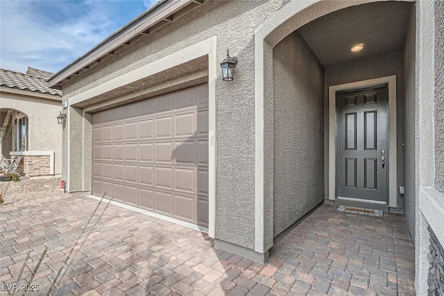 property entrance with a garage