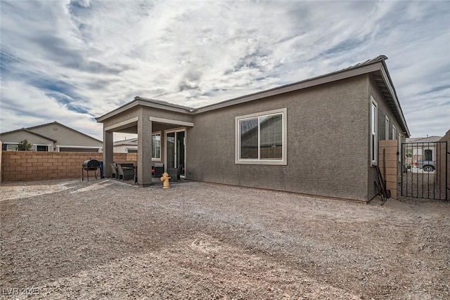 back of house featuring a patio area