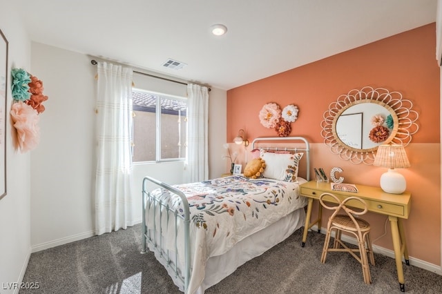 bedroom with dark colored carpet