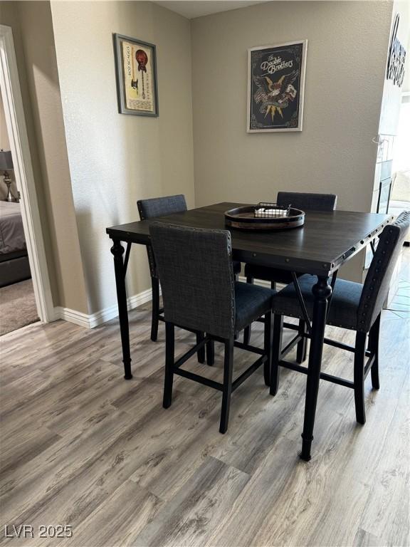 dining space featuring hardwood / wood-style floors