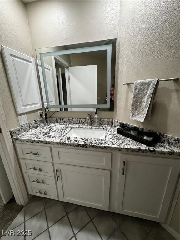 bathroom featuring vanity and tile patterned flooring