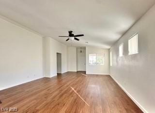 spare room with ceiling fan and dark hardwood / wood-style flooring