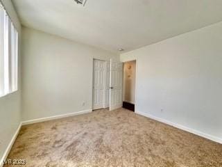 unfurnished bedroom with carpet flooring