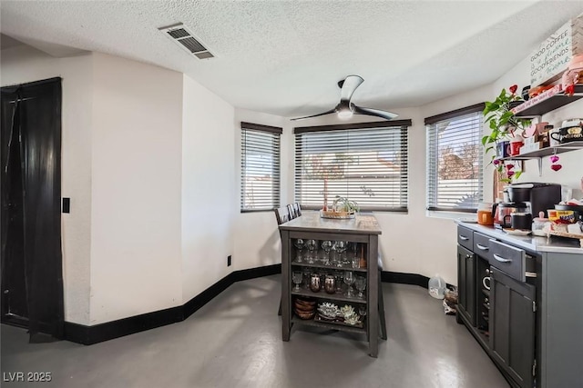 dining room with a textured ceiling