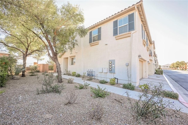 back of property featuring a garage